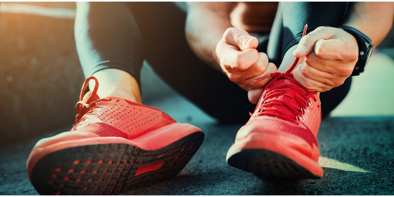 Person lacing running shoes
